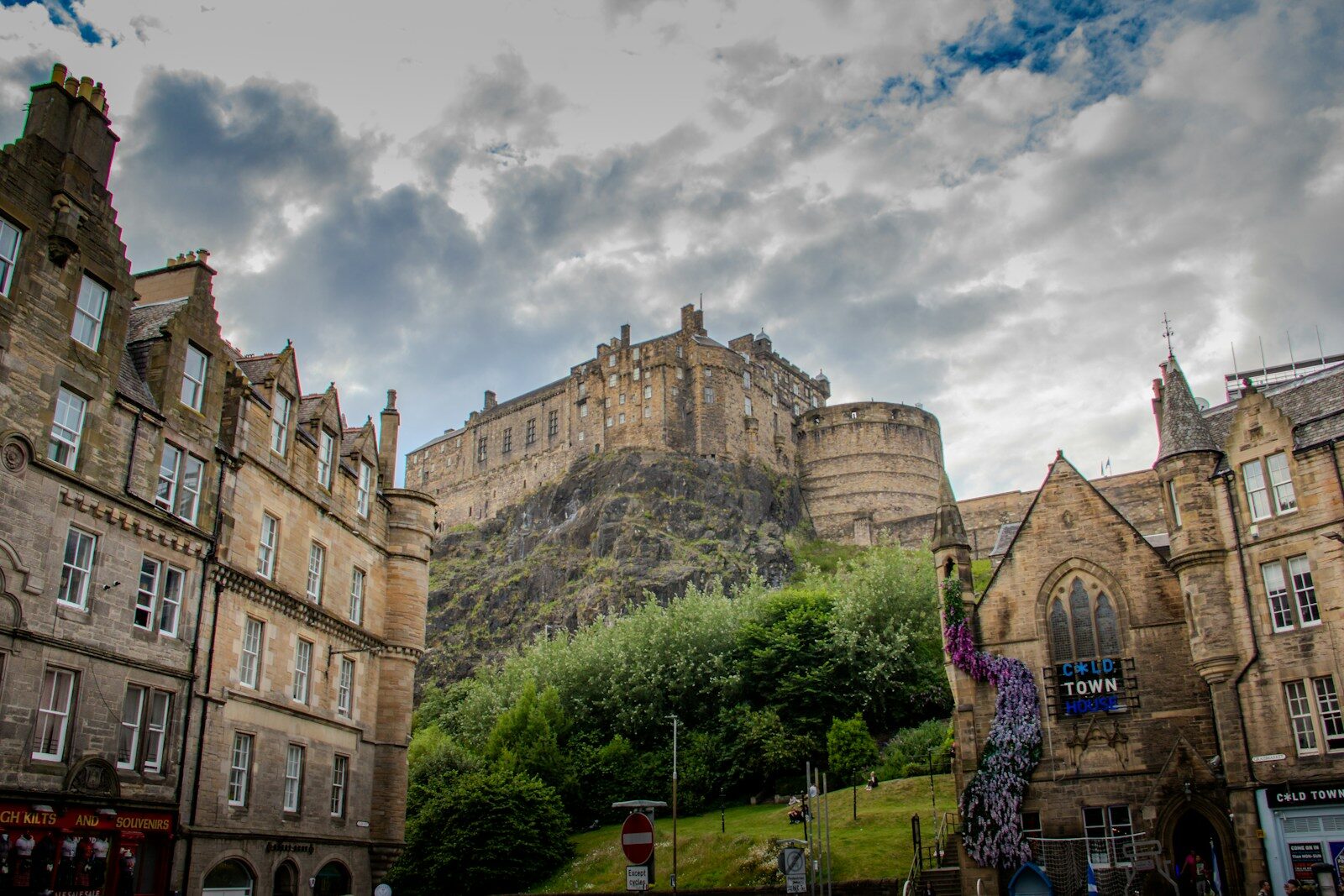 Edinburgh castle towers over the city buildings.