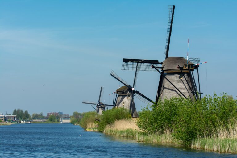 Best places to visit in the Netherlands featuring Amsterdam canals, windmills and Dutch attractions