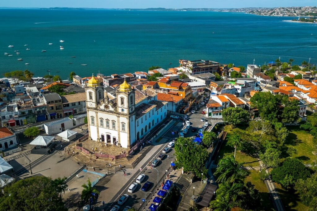 An aerial view of a city with a large body of water