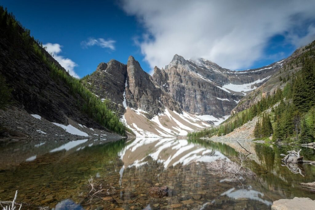 mountains under blue sky and white clouds