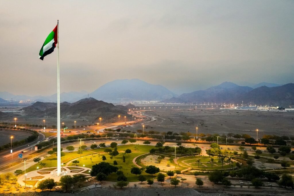 A flag pole with a flag on top of it