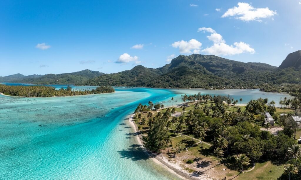 an aerial view of a tropical island and lagoon