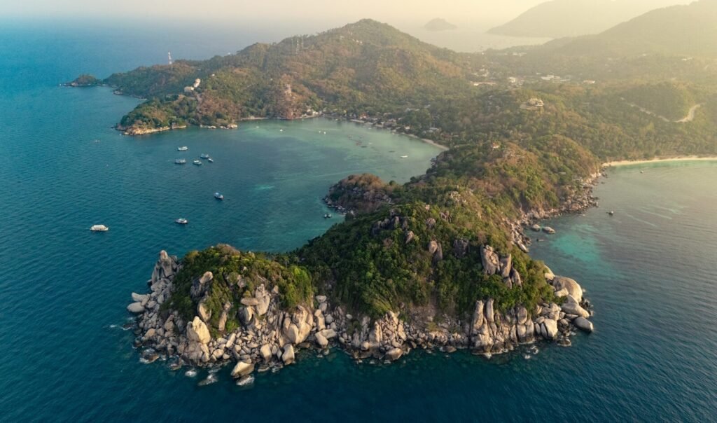 an aerial view of a small island in the middle of the ocean