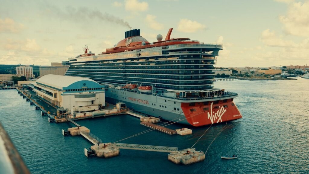 A large cruise ship docked at a pier